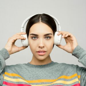 Woman with headphones listening to ADHD mindfulness meditation