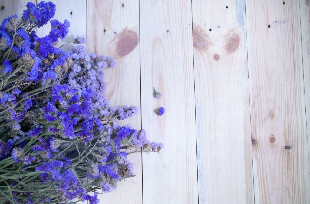 purple flowers on a wooden floor for tranquility and mindfulness